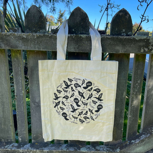 White Canvas tote bag with black print of native NZ birds on it.