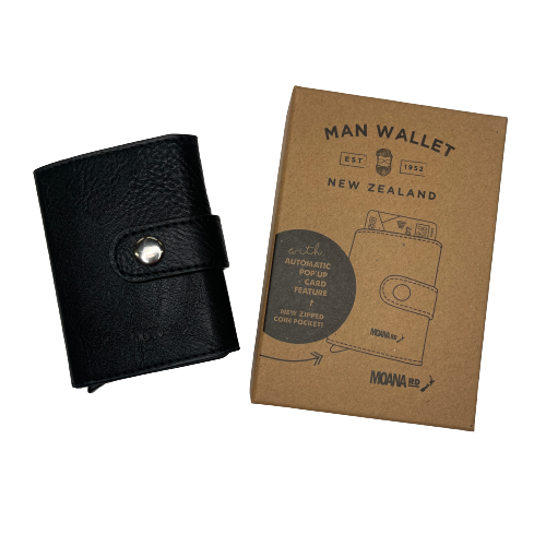 Small pocket wallet in black sitting next to the packaging it comes in.