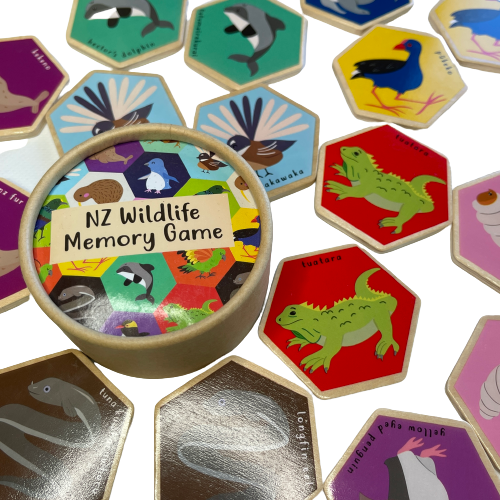 Hexagon wooden tiles with NZ Wildlife images on as part of a memory game.