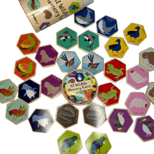 Hexagon wooden tiles with NZ Wildlife images on as part of a memory game.