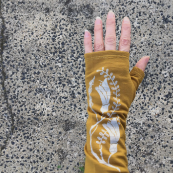 Merino Wool Gloves - Mustard Kowhai beautifully made in New Zealand by Kate Watts on a womans hand