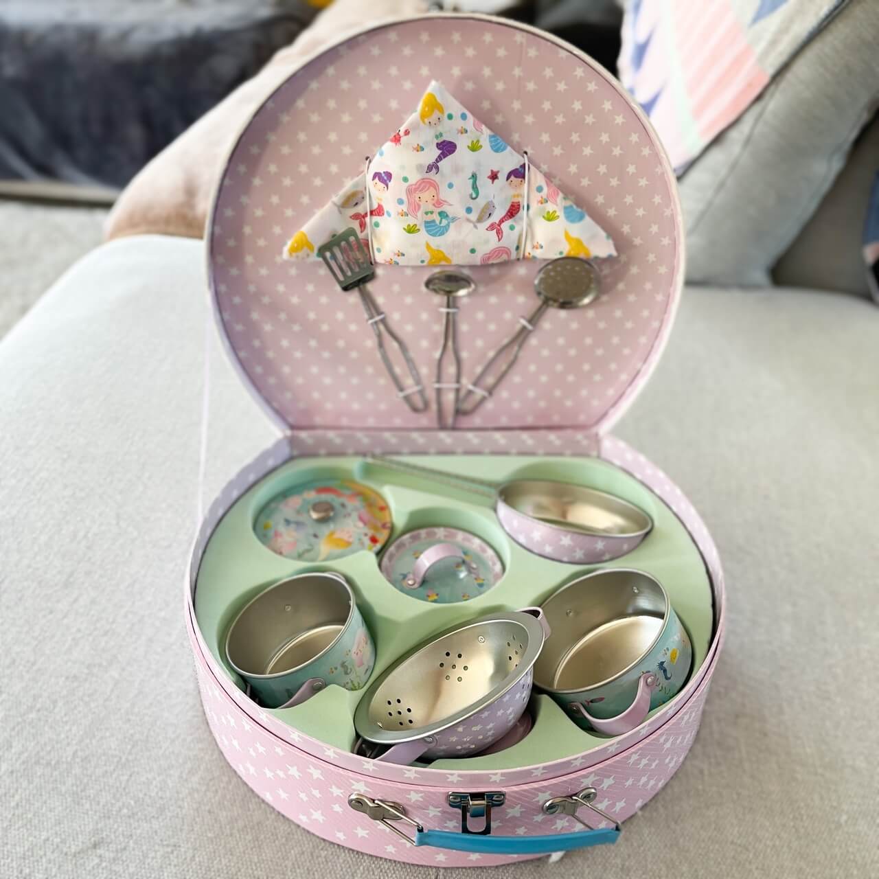 Childrens mermaid themed tin kitchen set in a round attache case.