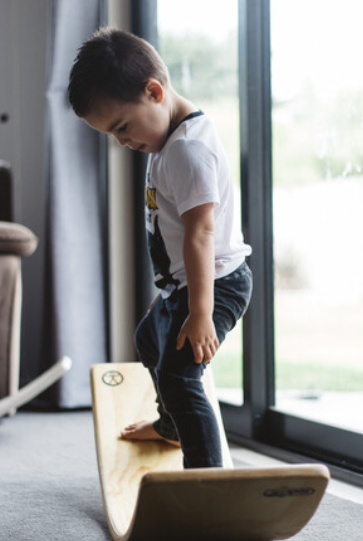 Middle Earth rockit balance board. Made in New Zealand with child playing..