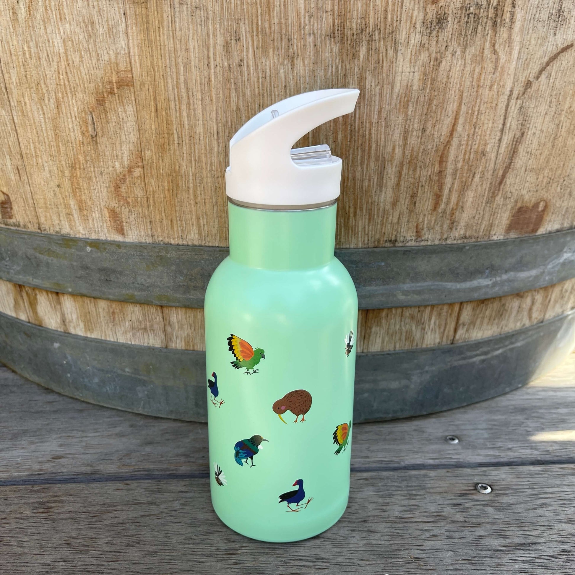 Small kids drink bottle with a sipper top in mint green with New Zealand birds on it.