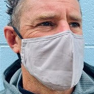 Man wearing a grey face mask.