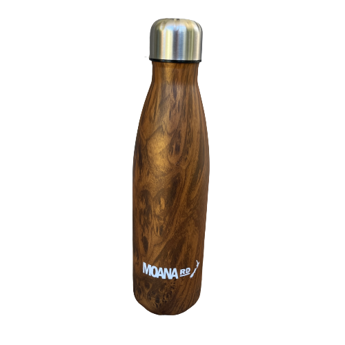 Drink bottle with a faux wood grain look sitting on a wooden bench.