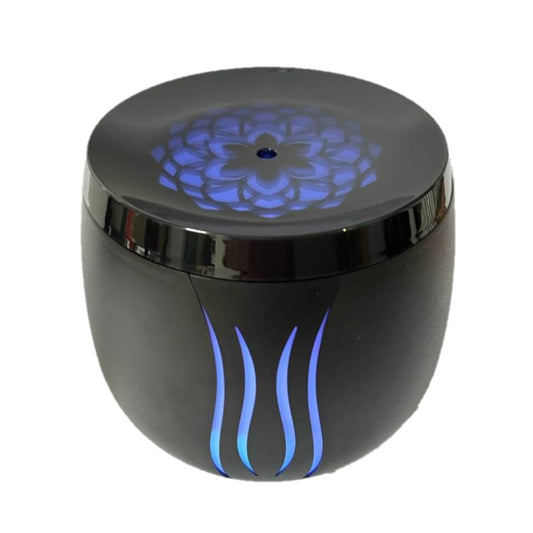 Ultrasonic Aroma Diffuser in black with flame lights on the side and a lotus flower light on top.