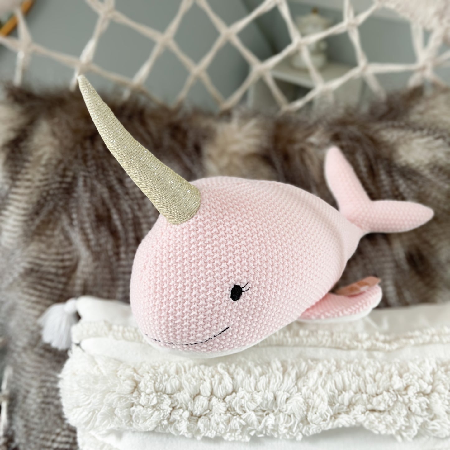 Pink Narwhal soft toy.