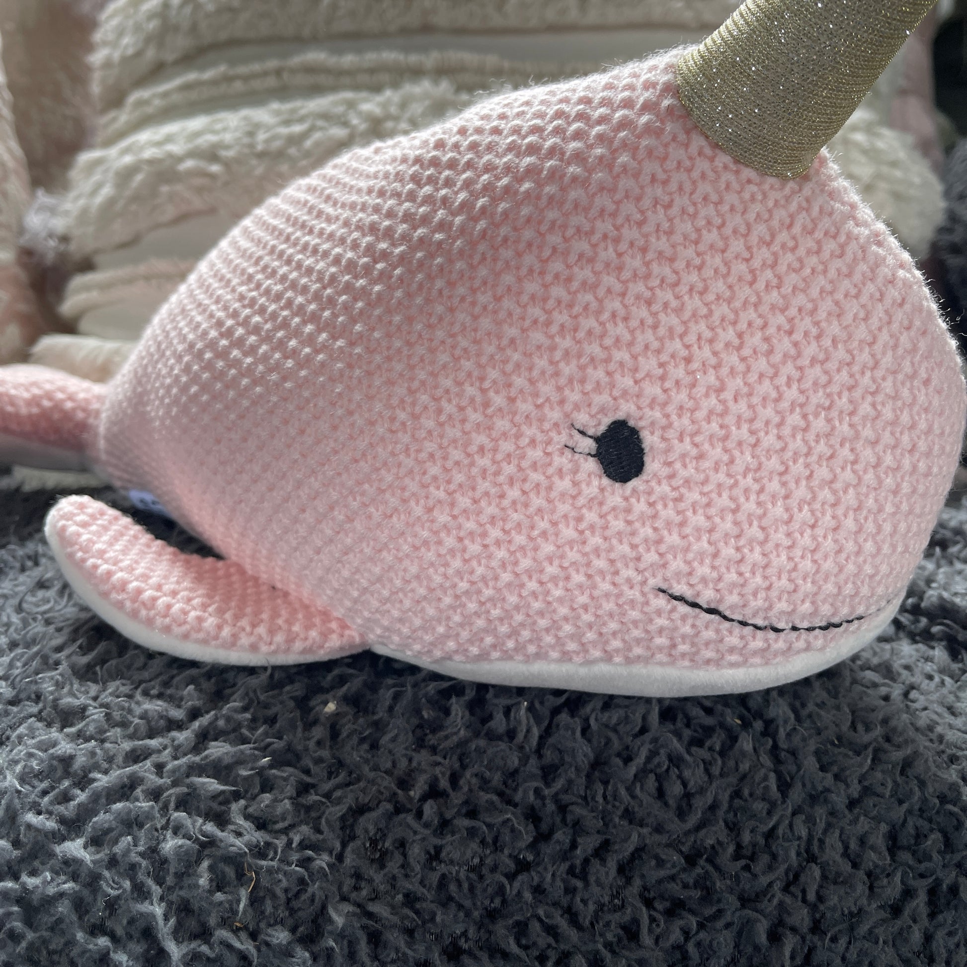 Pink Narwhal soft toy.