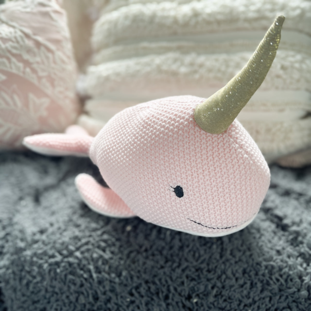 Pink Narwhal soft toy.
