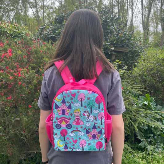 Bright pink childs backpack with blue front and princess pictures.