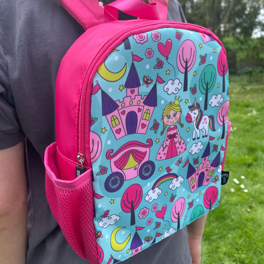 Bright pink childs backpack with blue front and princess pictures.