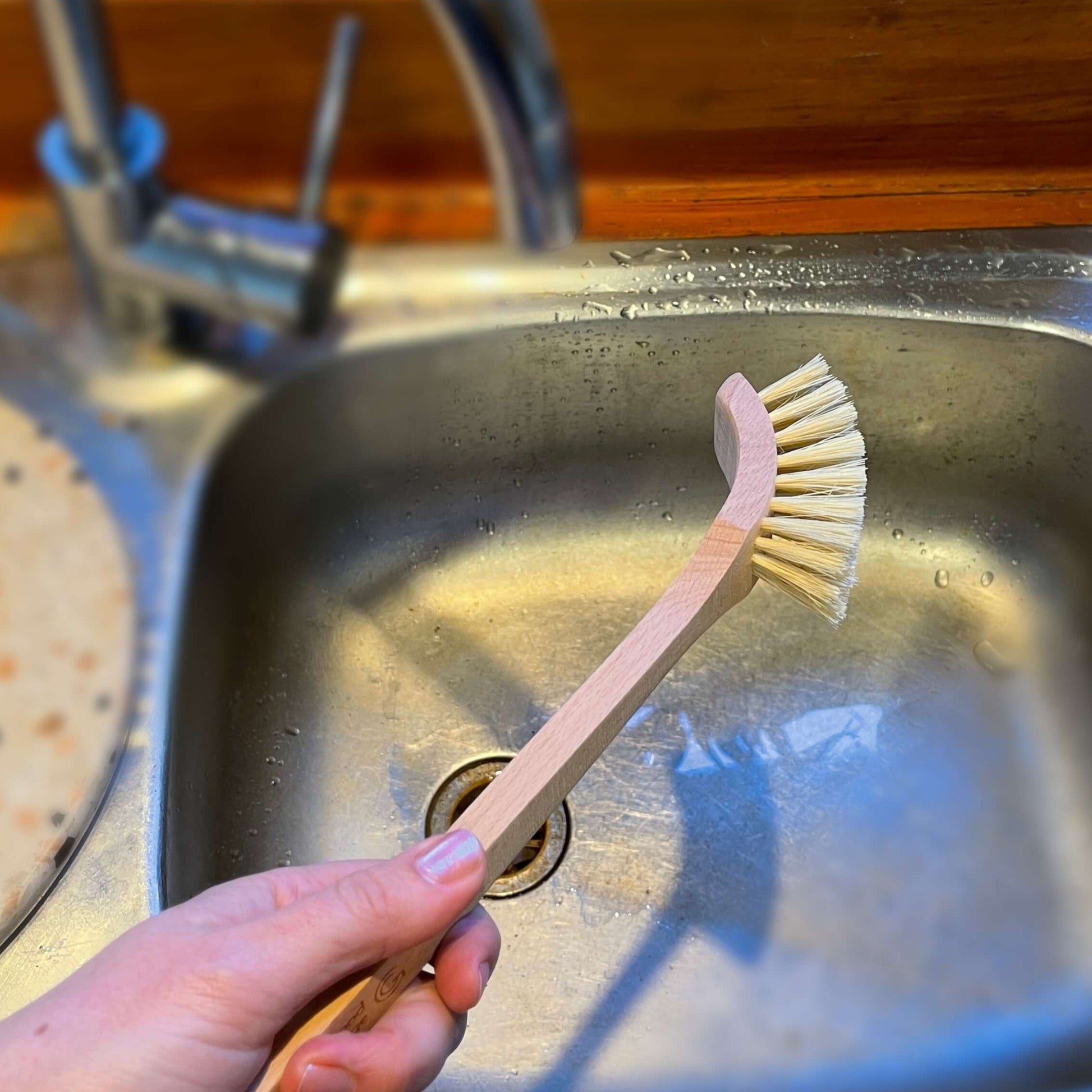 Wooden dish brush.