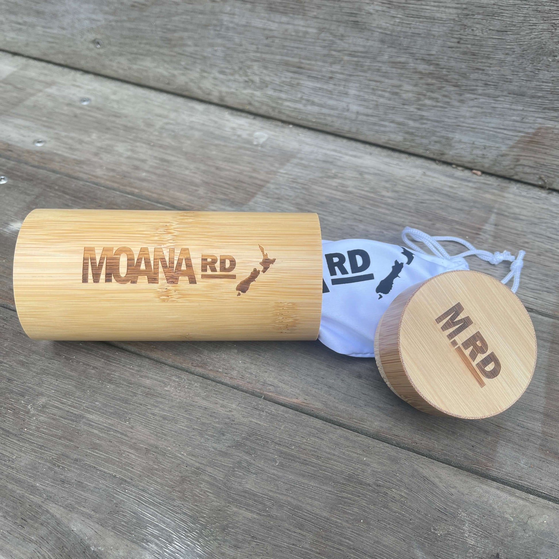 Round wooden sunglasses case.