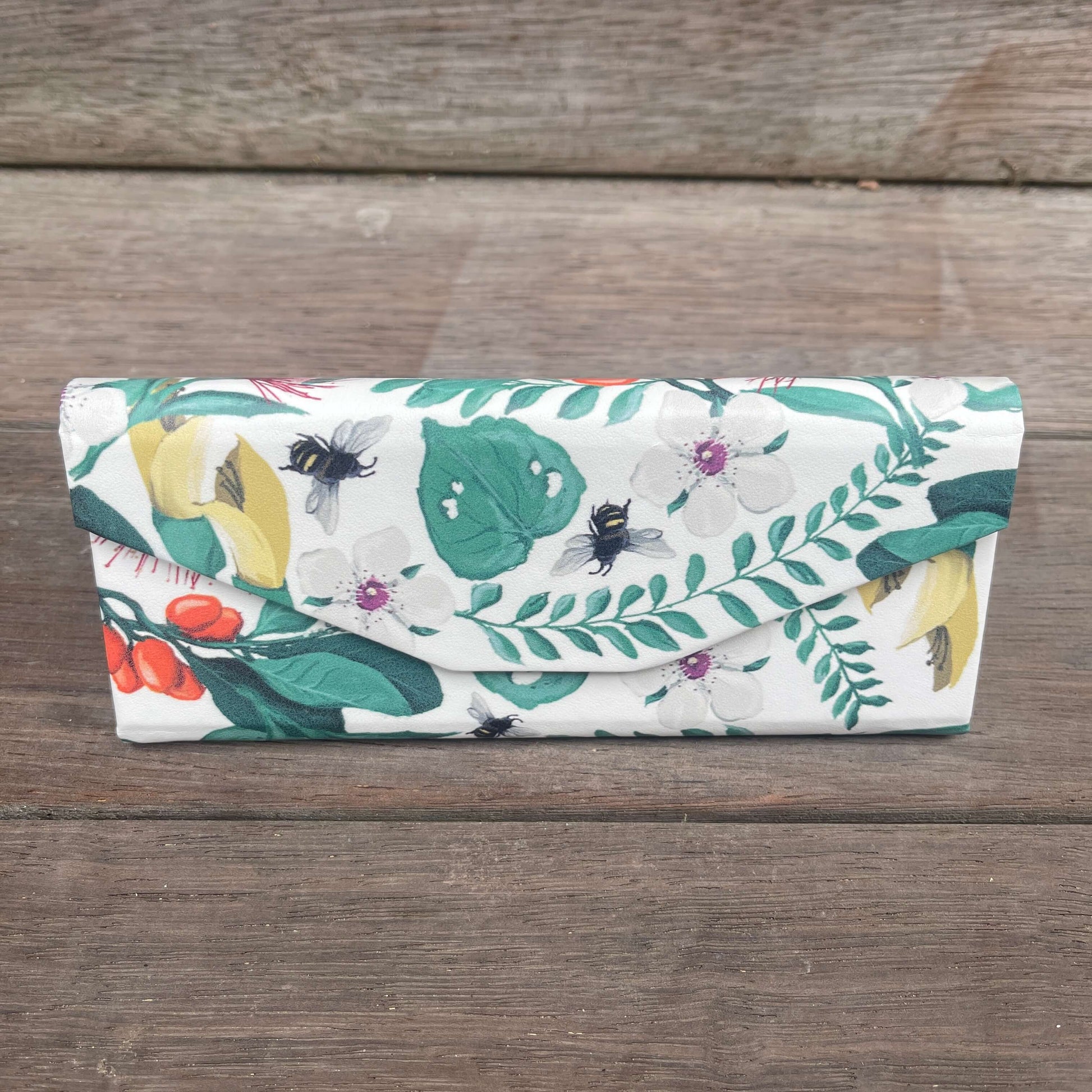 Floral sunglasses case that folds flat when not in use.