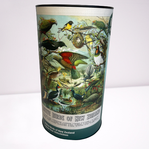 Cardboard tube with a jigsaw puzzle inside featuring artwork of native New Zealand birds.