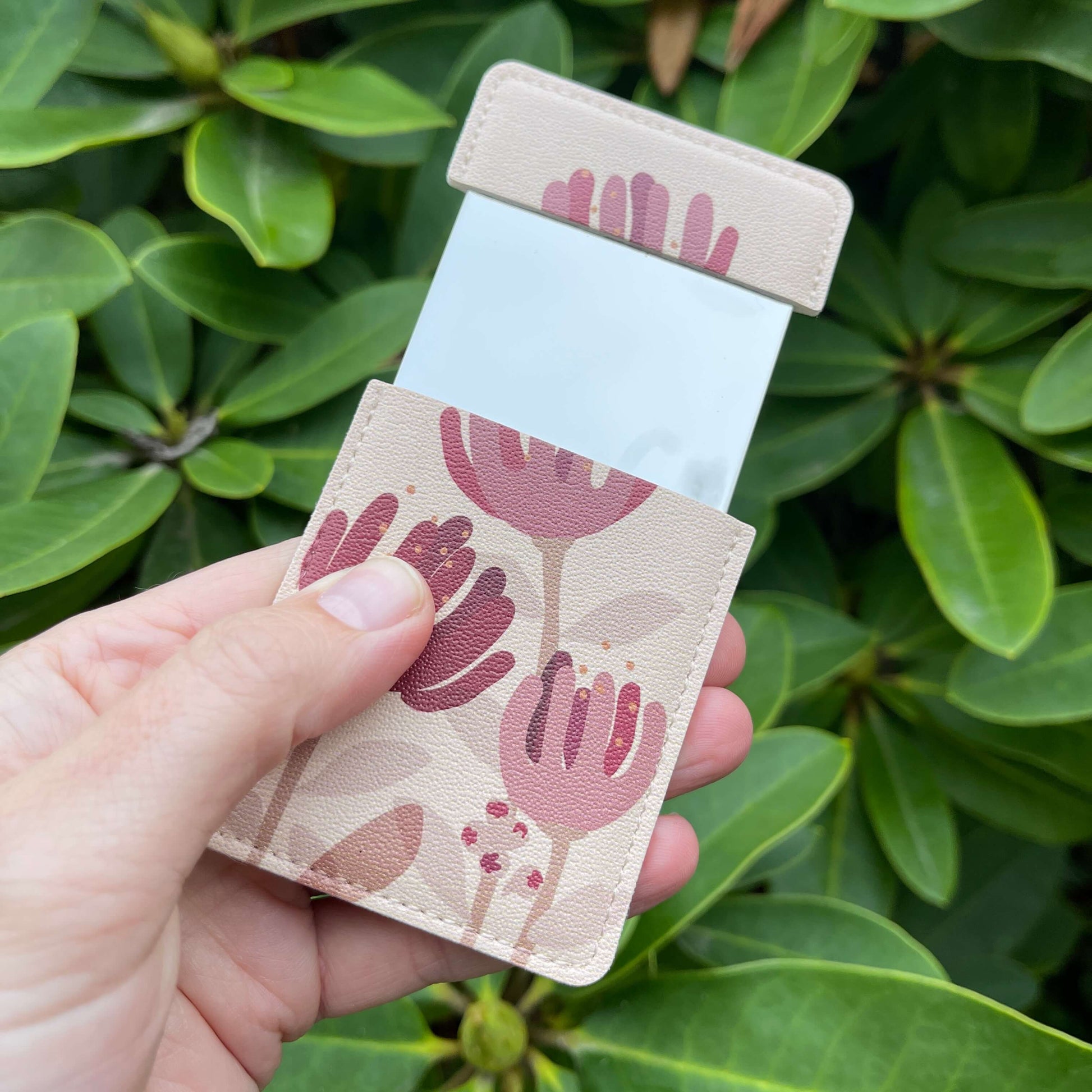 Pocket Mirror - Raw Pohutukawa Flower with demure brown background.
