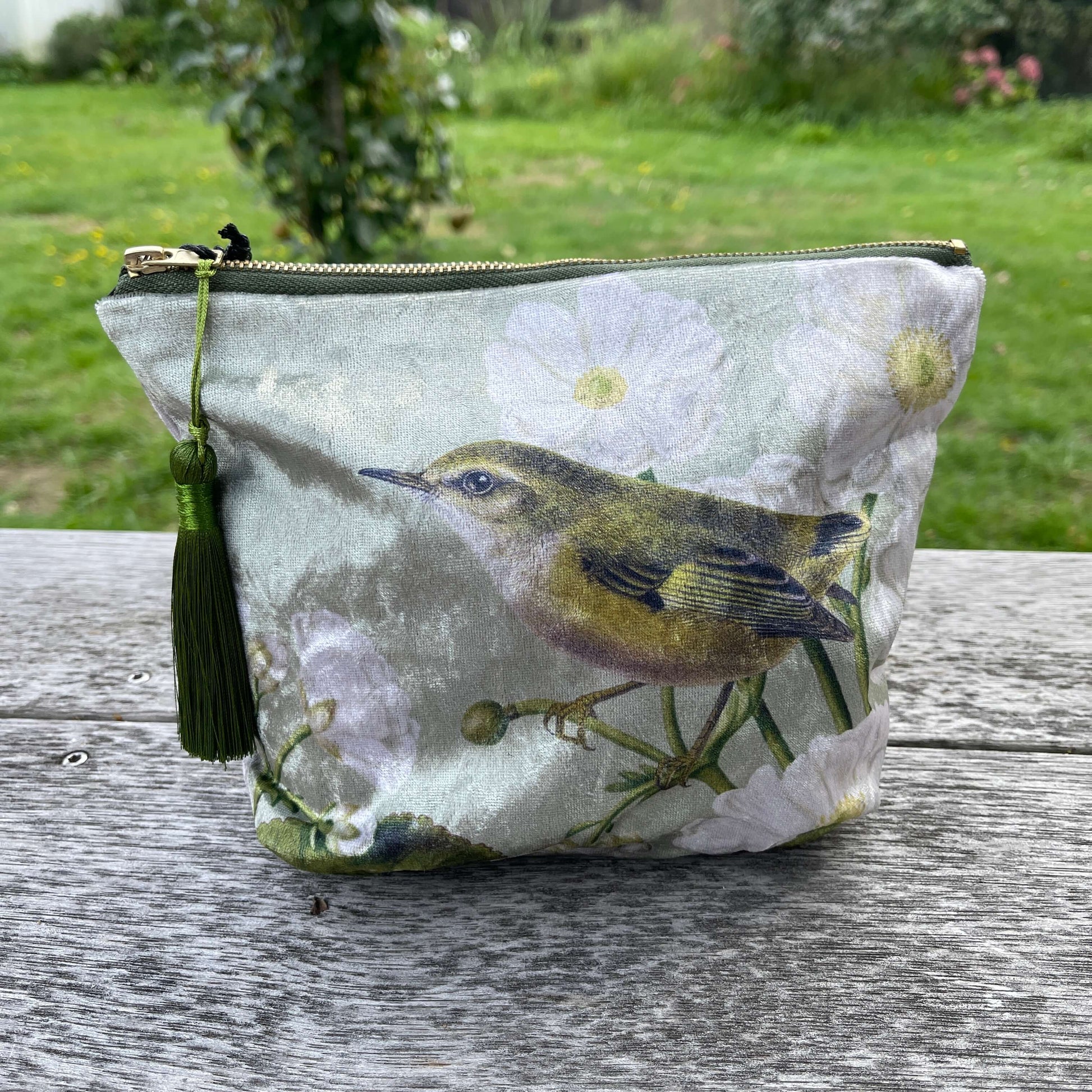 Velvet cosmetic bag featuring a Rifleman bird and Mt Cook Lily.