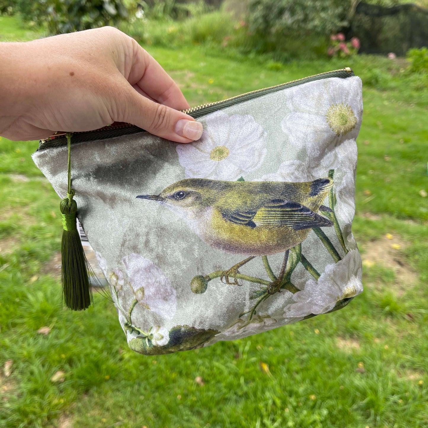 Velvet cosmetic bag featuring a Rifleman bird and Mt Cook Lily.