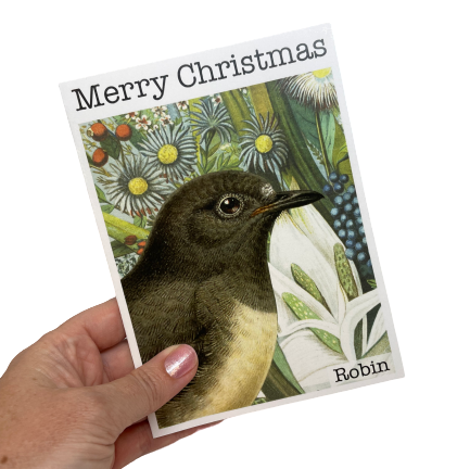 Christmas card with a Robin bird and flowers.