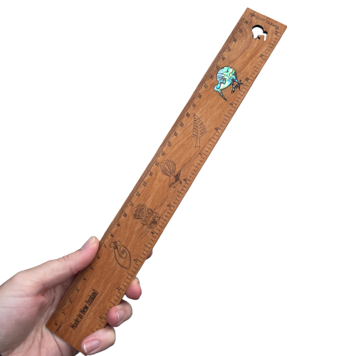 Wooden rimu ruler with paua shell Kiwi bird inlay.