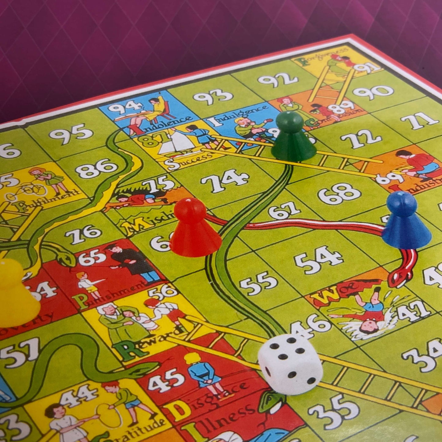 Snakes and ladders board game.