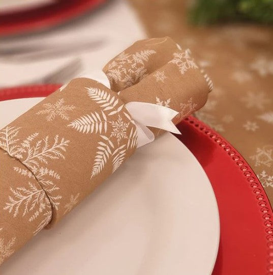 Reusable Christmas Crackers in beige with white snowflake print.
