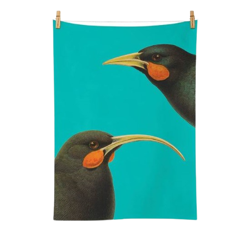Bright blue tea towel with 2 Huia birds on it.