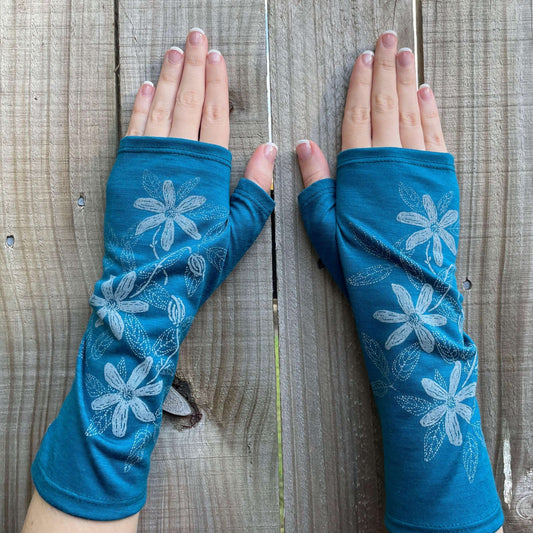Fingerless merino gloves in teal with white clematis print.
