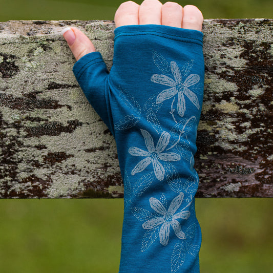 Fingerless merino gloves in teal with white clematis print.