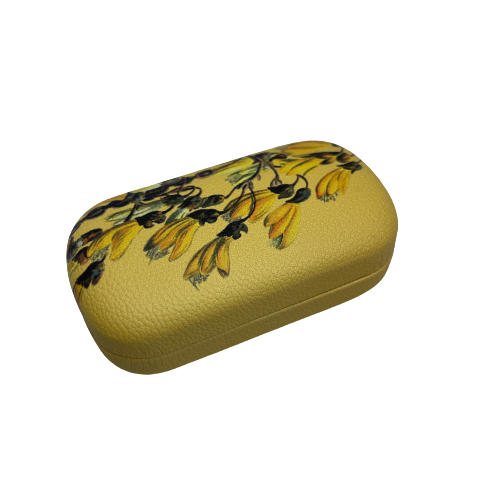 Small trinket case in bright yellow with Kowhai flowers on it.