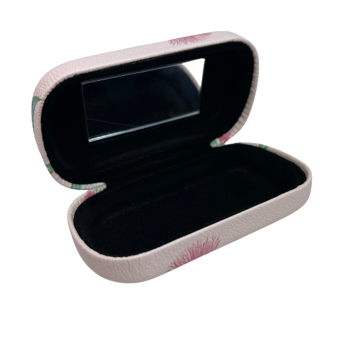 Small trinket case opened showing the mirror and black lining.