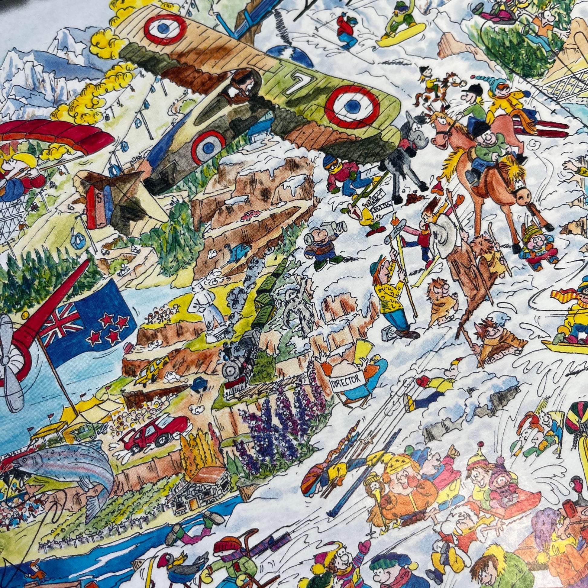 Close up of a Jigsaw puzzle with artwork featuring Queenstown & Wanaka.