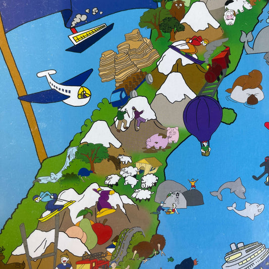 Close up of a Jigsaw puzzle with artwork featuring the South Island of New Zealand.