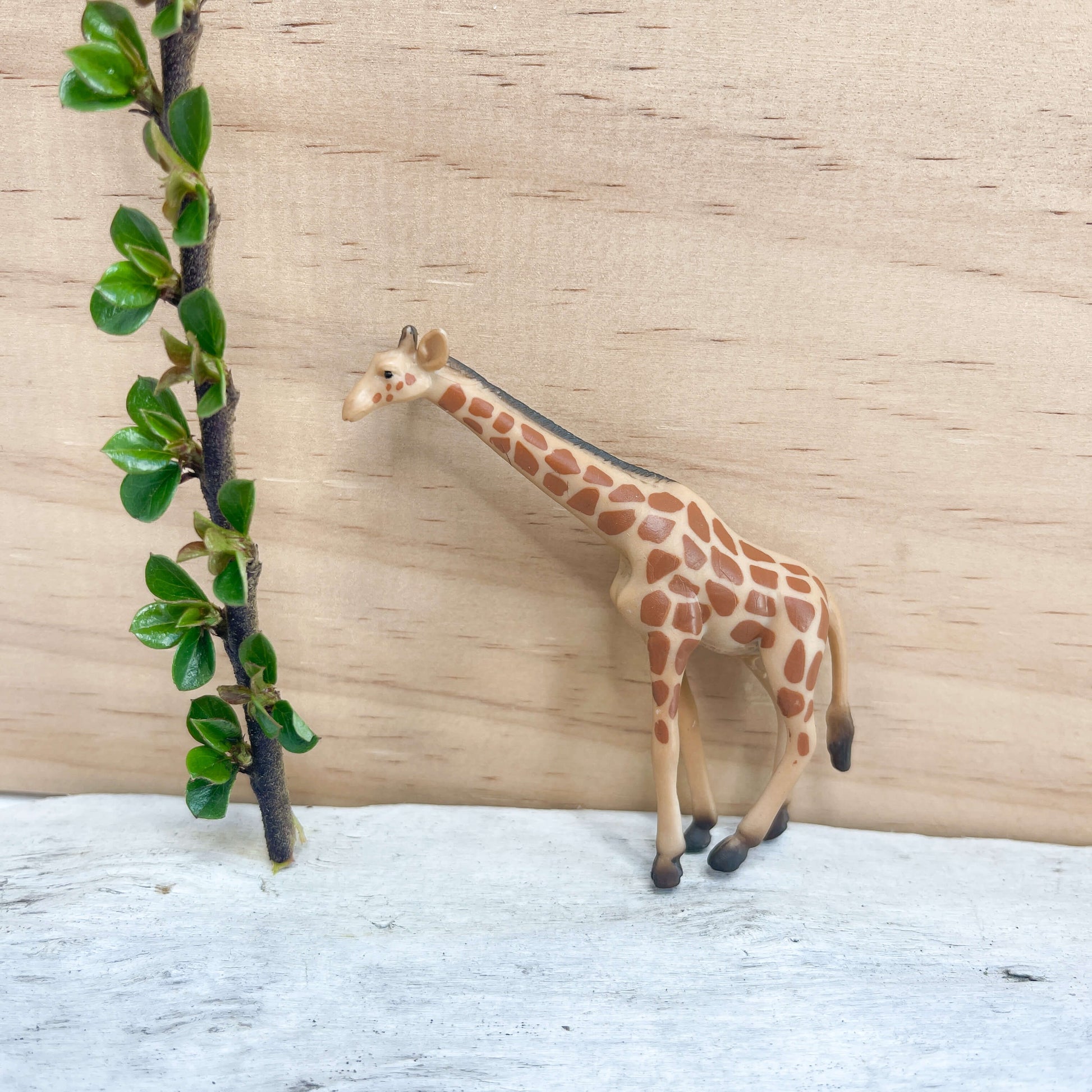 Mini giraffe figurine.