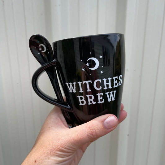 Witches brew mug in black with matching spoon.