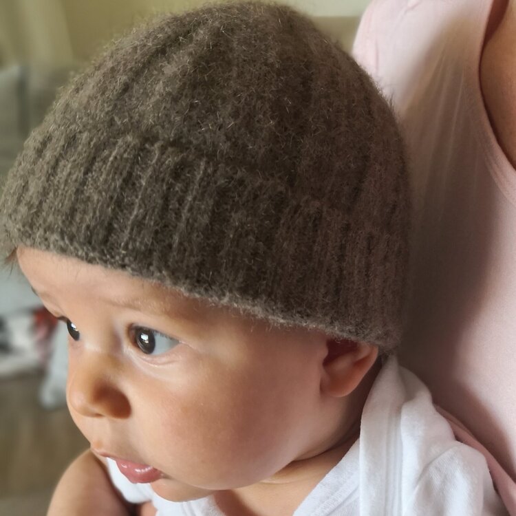 Baby wearing a brown knot beanie from Wyld.
