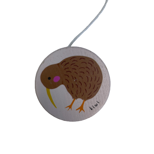 Pale pink wooden yoyo with a Kiwi bird painted on it.