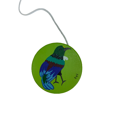 Bright green wooden yoyo with a Tui bird painted on it.