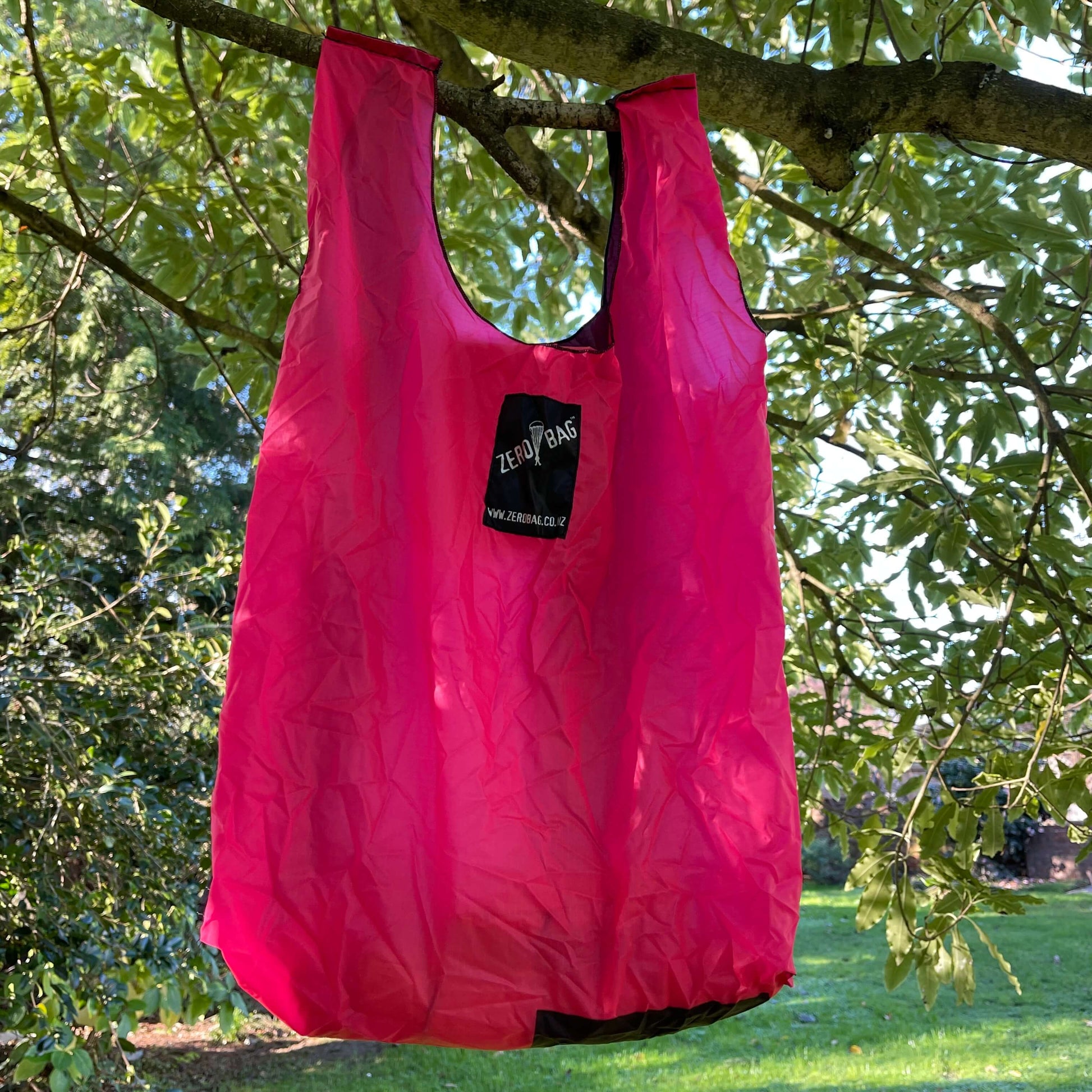 Bright pink tote bag made from parachutes.