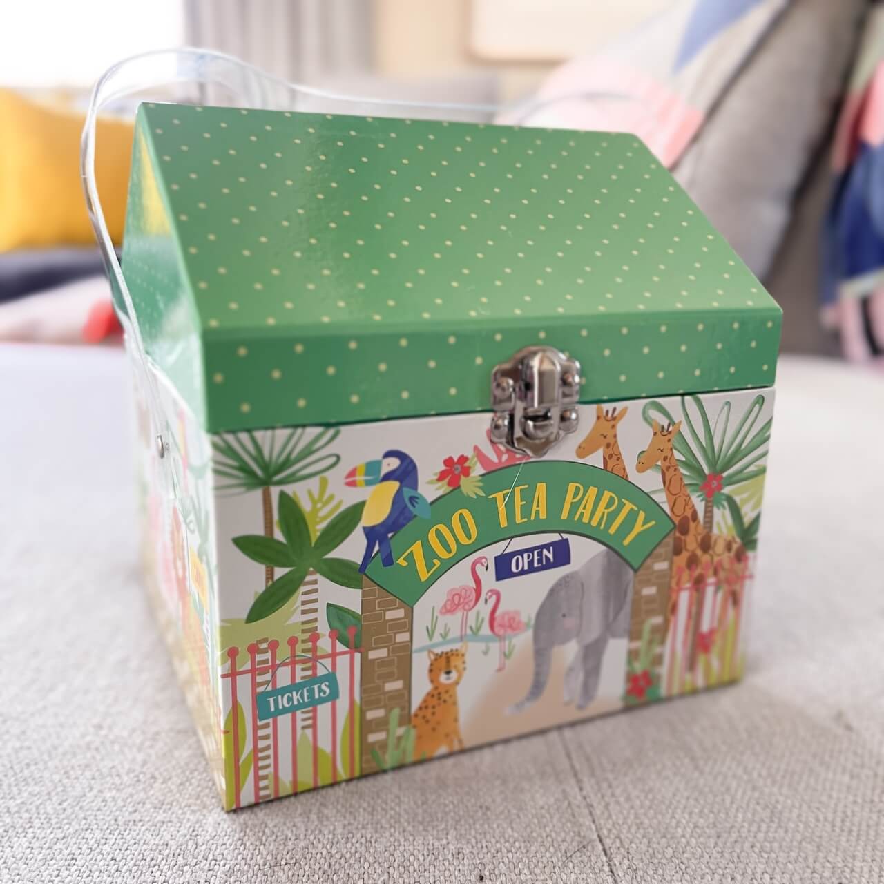 Childrens tin zoo themed tea set in a house shaped attache box.