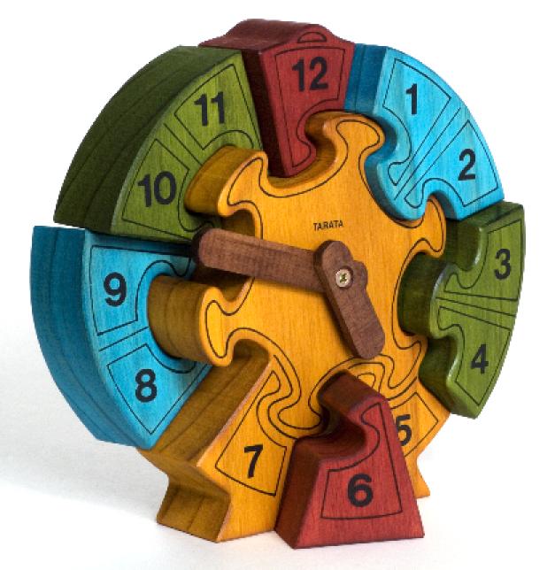 Wooden puzzle clock in various colours.