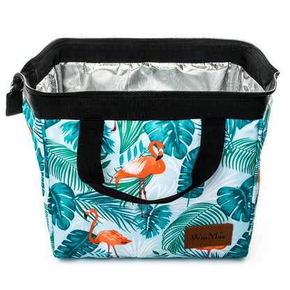 Winmax cooler bag in white with minty green tropical foliage and pink flamingo print.