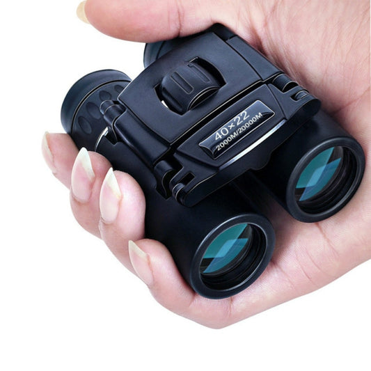 Small binoculars in womans hand.
