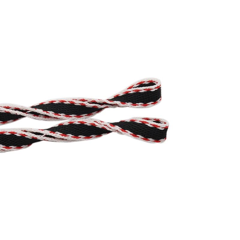 Black shoelaces with red and white edging.
